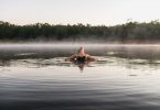 Woman swimming in cold water