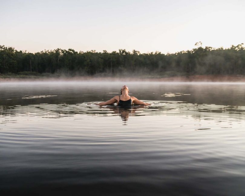 Woman swimming in cold water